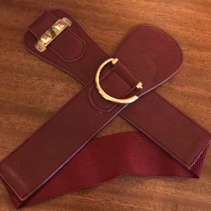 Maroon belt with studded and gold detail.